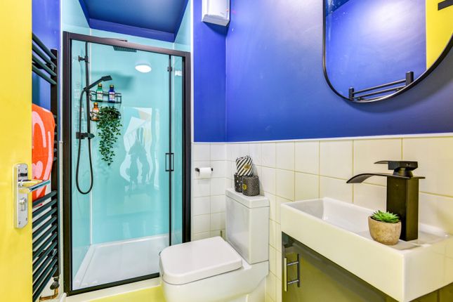 Bright And Stylish Bathroom Featuring A Modern Sho...