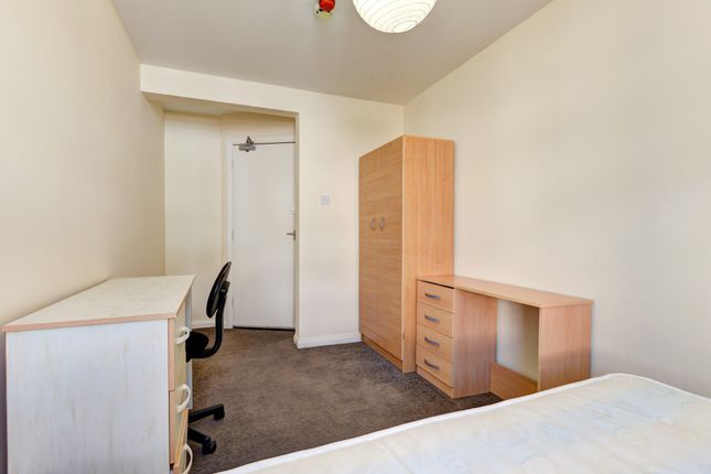 A Simple, Tidy Single Bedroom With Essential Furni...