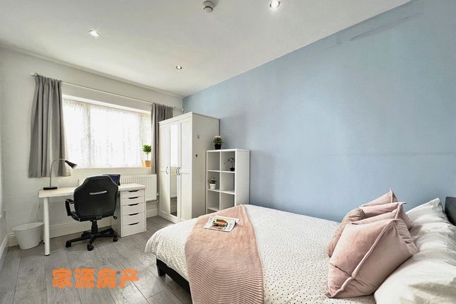 A Bright And Inviting Double Bedroom Featuring A c...