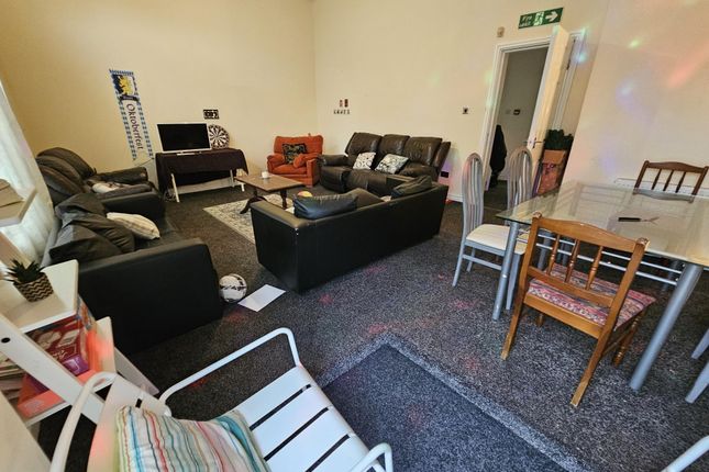 Bright And Welcoming Living Room Featuring Multipl...