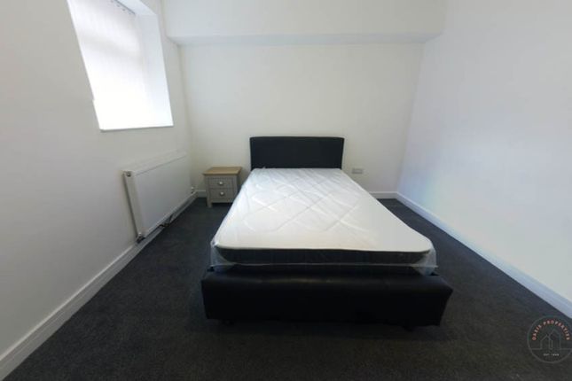 A Spacious Master Bedroom With A Comfortable Bed, ...