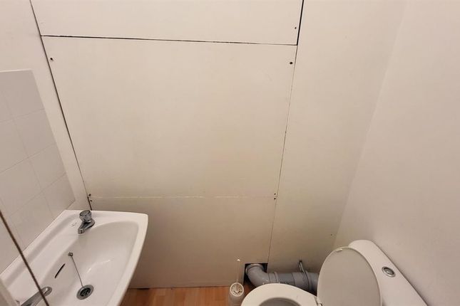 Compact And Clean Single Toilet Featuring A White ...