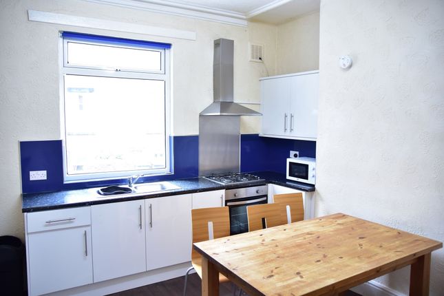 Bright And Tidy Kitchen Featuring A Large Window W...