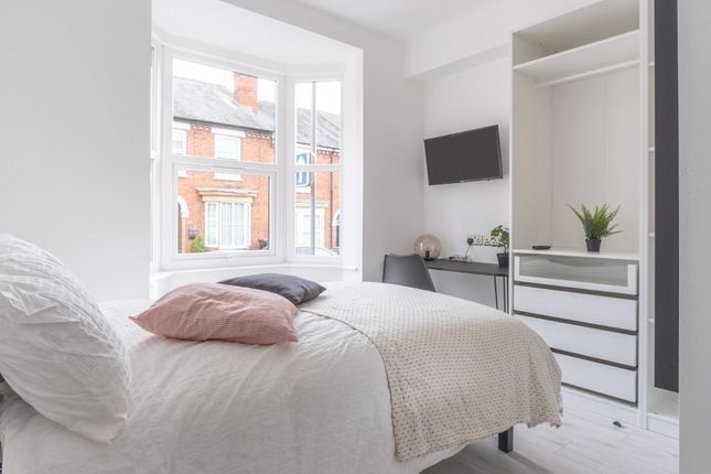 Bright And Stylish Master Bedroom Featuring A Larg...