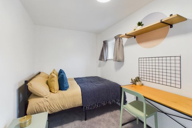 A Bright And Inviting Double Bedroom Featuring A c...