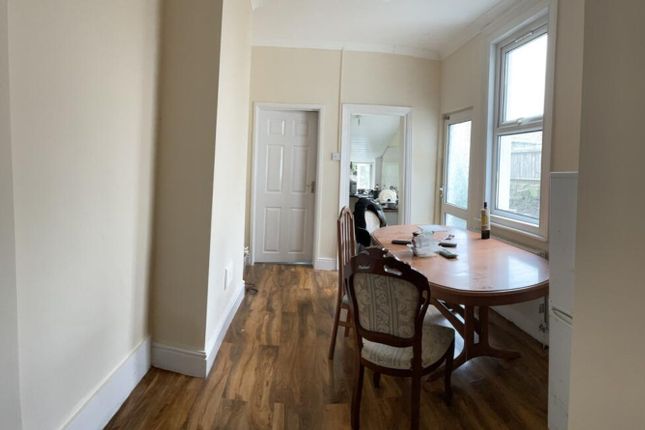 A Well-Lit Kitchen With A Spacious Dining Area, Fe...