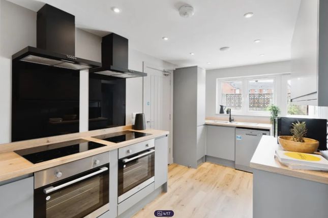 A Modern And Bright Kitchen Featuring Sleek Applia...