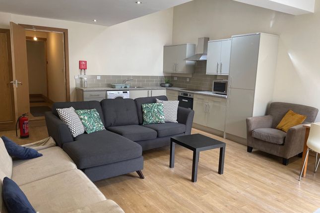 Bright And Spacious Living Room Featuring Modern F...