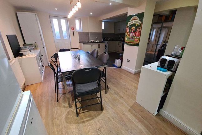 Bright And Spacious Living Room Featuring Modern F...