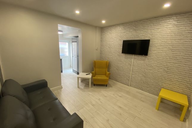 A Modern Living Room Featuring A Cozy Seating Area...