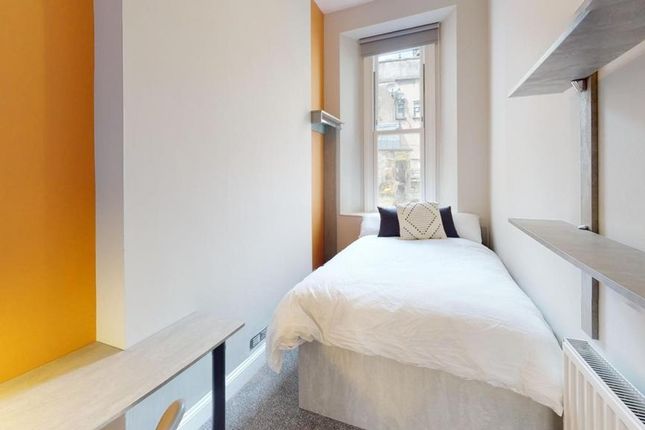A Bright And Tidy Single Bedroom With Modern Decor...