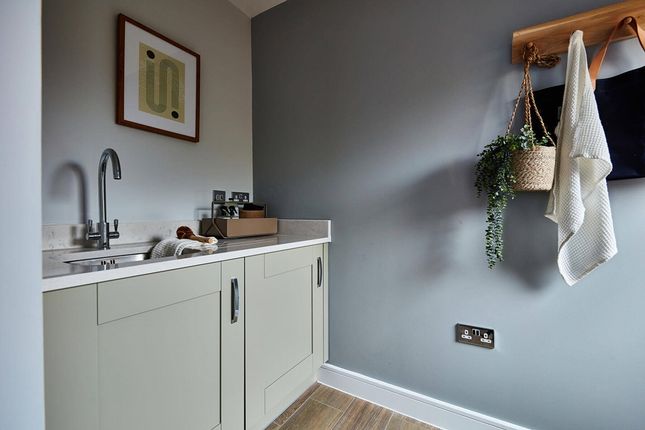 The Kitchen Also Hosts An Adjoining Utility Area