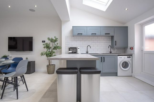 Modern And Bright Kitchen Area Featuring Stylish B...