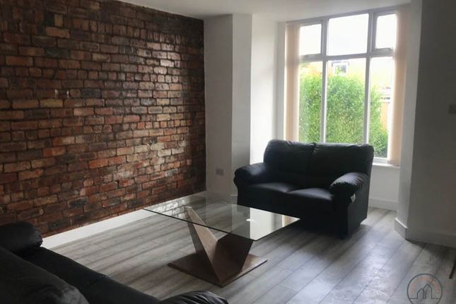 Bright, Modern Living Room With An Exposed Brick F...