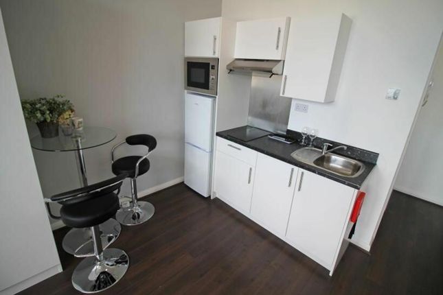 Modern Kitchen Featuring Sleek Cabinetry, A Conven...