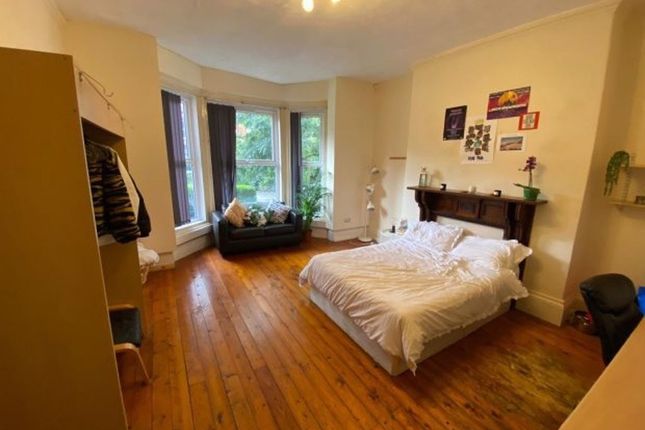 A Spacious And Inviting Master Bedroom Featuring A...
