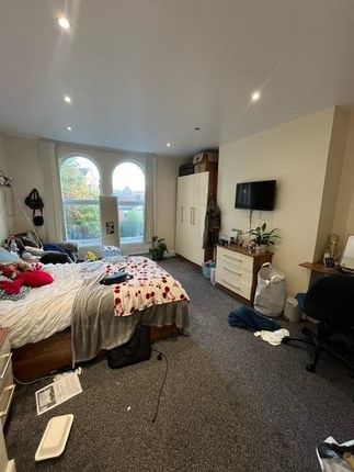 A Modern Living Room Featuring A Large Window That...