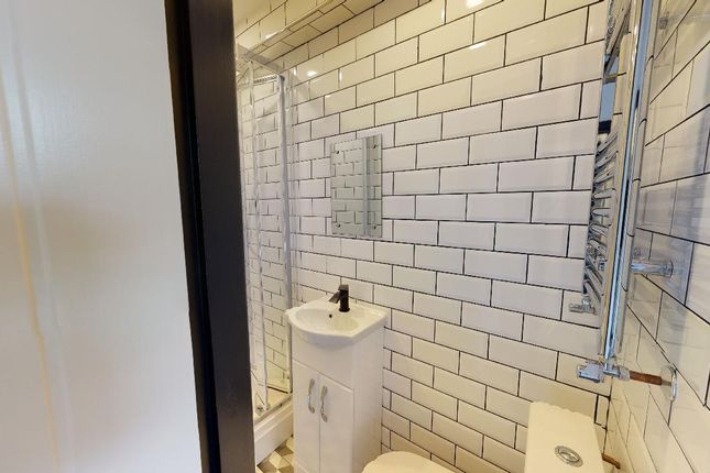 A Modern, Clean Bathroom With White Subway Tiles, ...