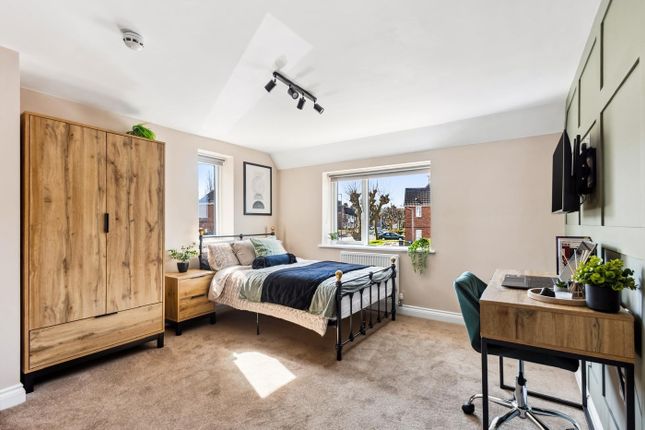 This Inviting Double Bedroom Features Ample Natura...