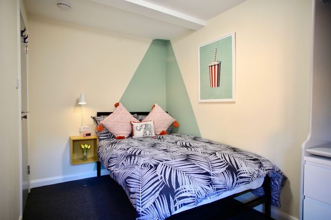 A Neatly Presented Double Bedroom Featuring A Styl...
