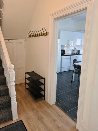 Bright And Tidy Hallway Featuring Light Wooden Flo...