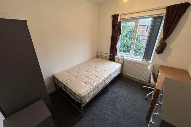 A Neat And Cozy Bedroom Featuring A Single Bed, A ...