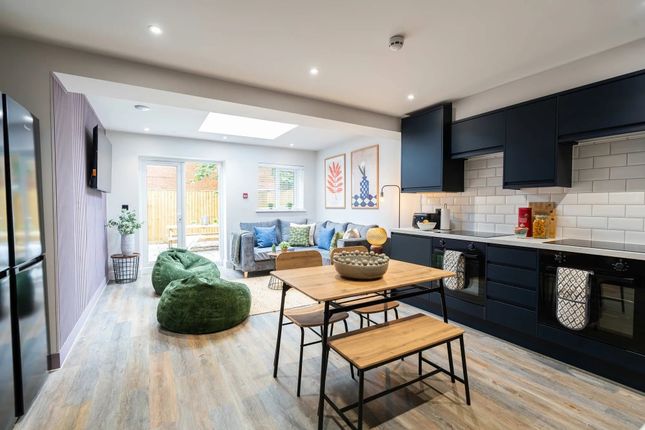 Bright And Spacious Living Room Featuring Contempo...