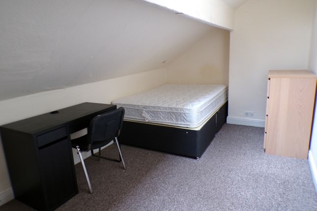 A Spacious Double Bedroom Featuring A Desk And Amp...