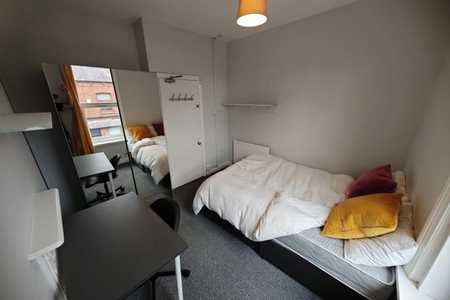 Cozy Single Bedroom Featuring A Comfortable Bed Wi...