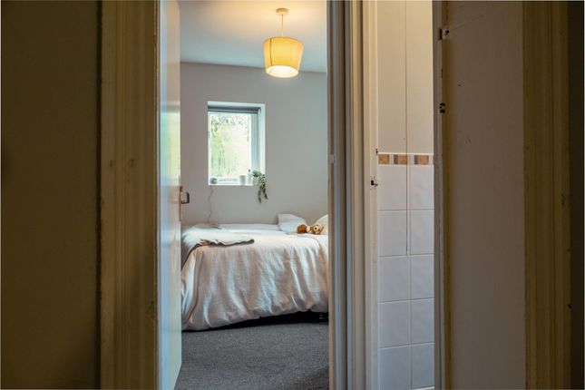 A Bright And Tidy Bedroom Featuring A Comfortable ...