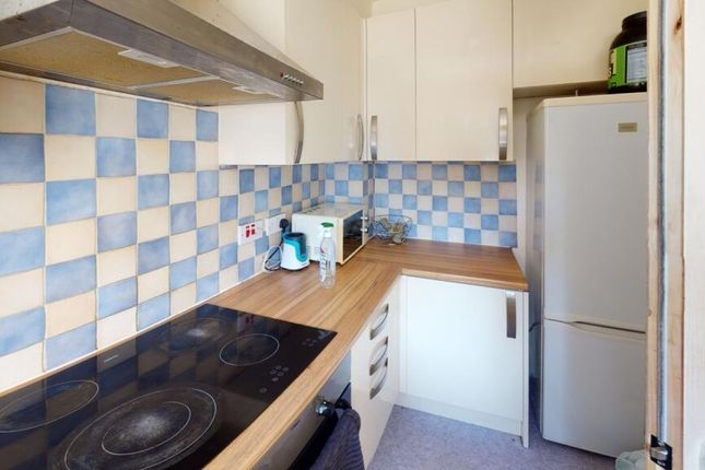 Compact And Functional Kitchen Featuring A Modern ...