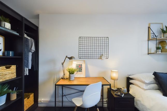 A Bright And Inviting Double Bedroom Featuring A S...