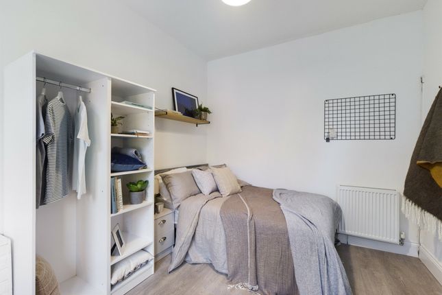 A Bright And Welcoming Bedroom Featuring A Double ...