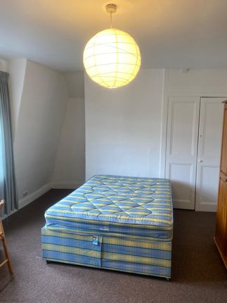 A Neat Double Bedroom Featuring A Comfortable Doub...