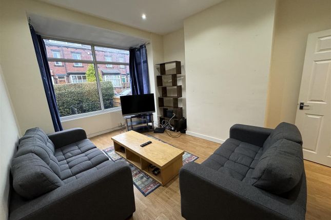 Bright And Welcoming Living Room Featuring Two Com...