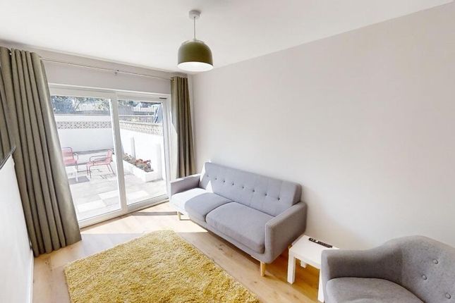 Bright And Cozy Living Room Featuring Soft Grey Se...