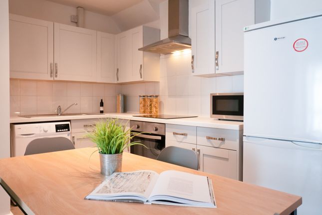 Bright And Modern Kitchen With Ample Cabinetry, A ...