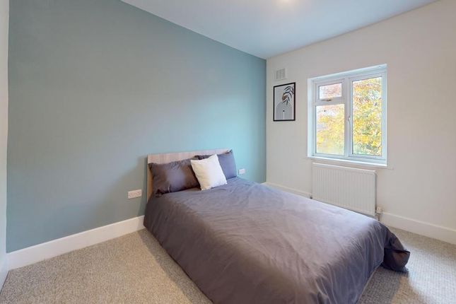 A Bright And Inviting Double Bedroom With A Modern...