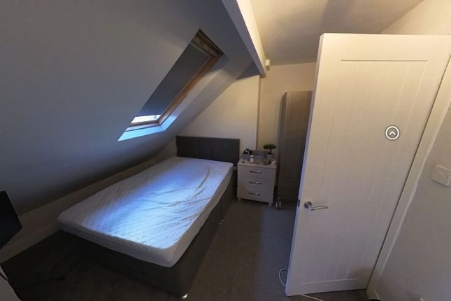 A Compact Bathroom Featuring A Toilet And Minimal ...