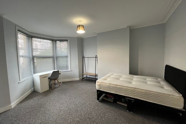 A Spacious And Bright Double Bedroom Featuring A c...