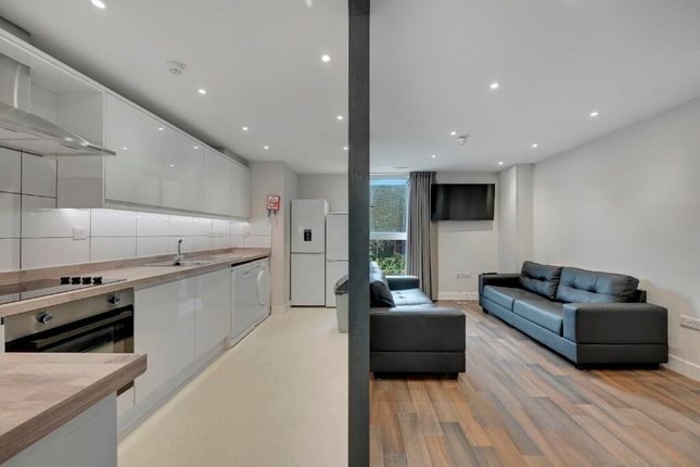 A Modern, Bright Living Room Featuring Sleek Black...