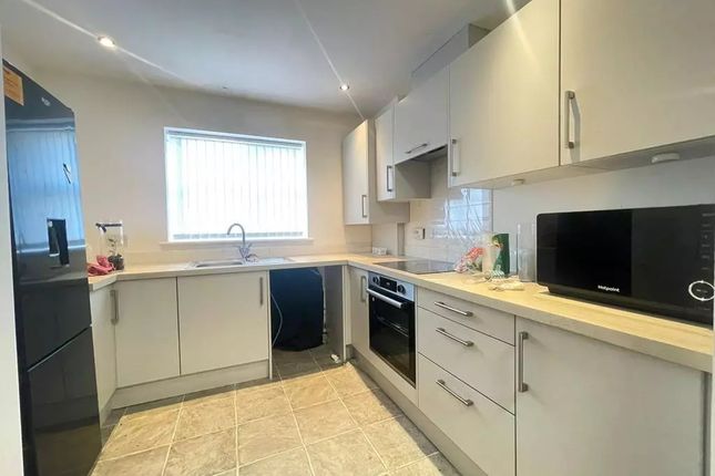This Modern Kitchen Boasts Ample Counter Space And...