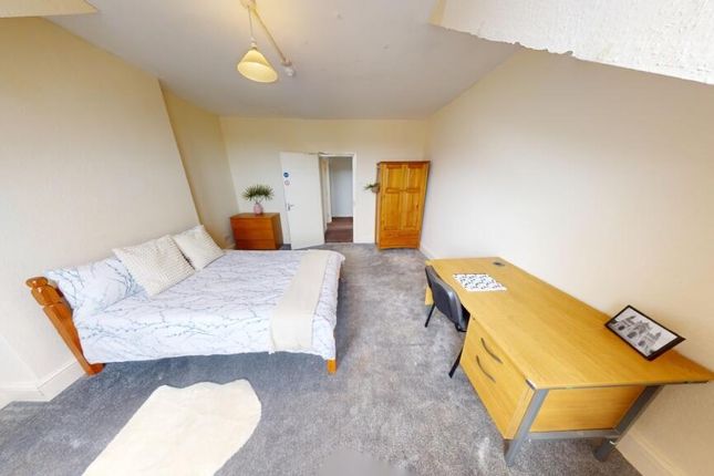 Spacious And Tidy Master Bedroom Featuring A Large...