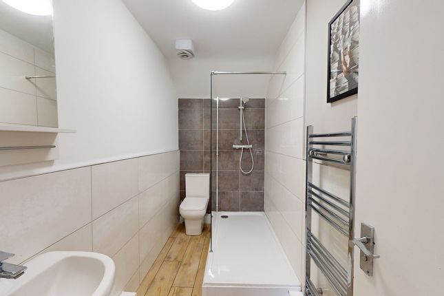 A Modern And Clean Bathroom Featuring Sleek Tiles ...