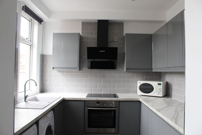 Modern And Sleek Kitchen With Ample Natural Light ...