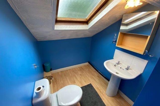 A Clean And Modern Single Toilet Room Featuring A ...