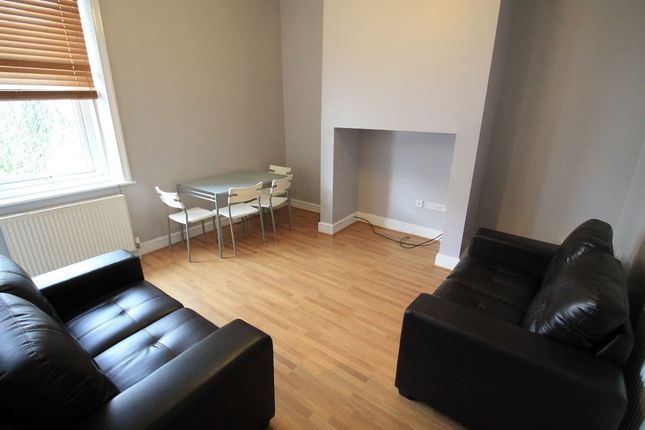 A Well-Lit, Modern Living Room Featuring Comfortab...