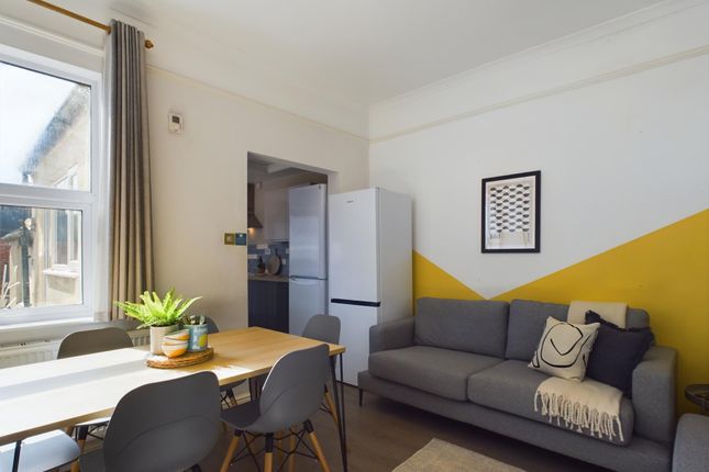 A Bright, Modern Living Room Featuring A Comfortab...