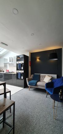 This Inviting Living Room Features A Stylish Sofa ...