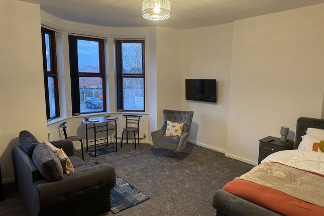 A Spacious And Inviting Master Bedroom Featuring A...